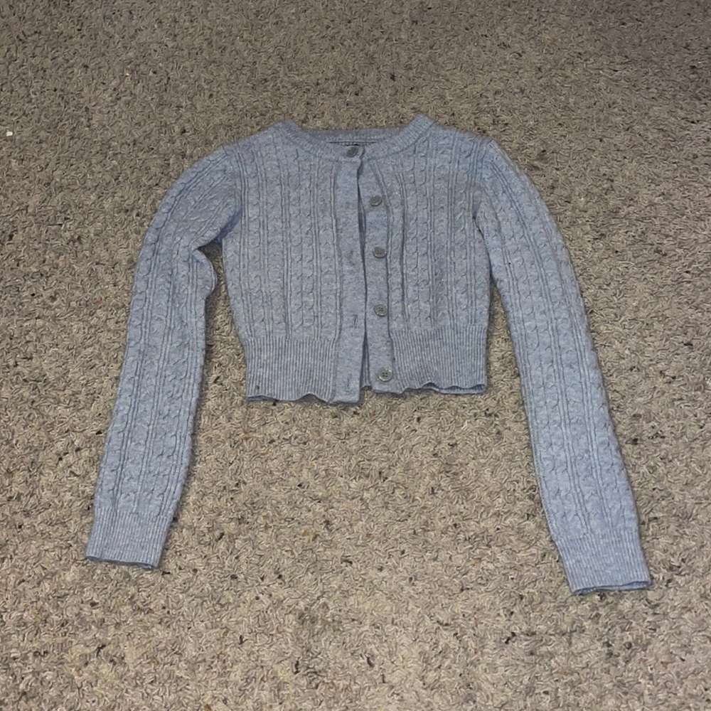 A grey button up crop top